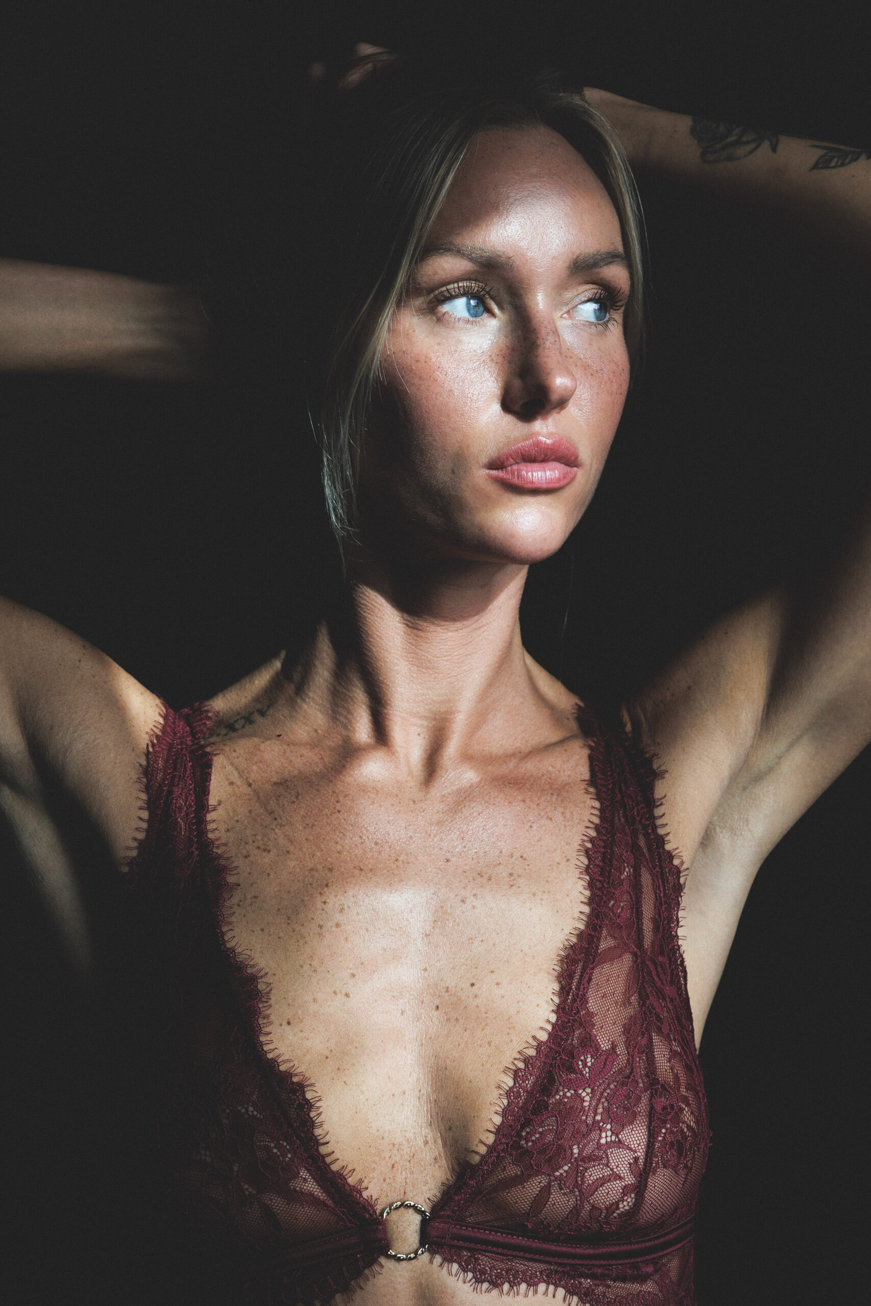 Moody Portrait of a Freckled Woman in Lace